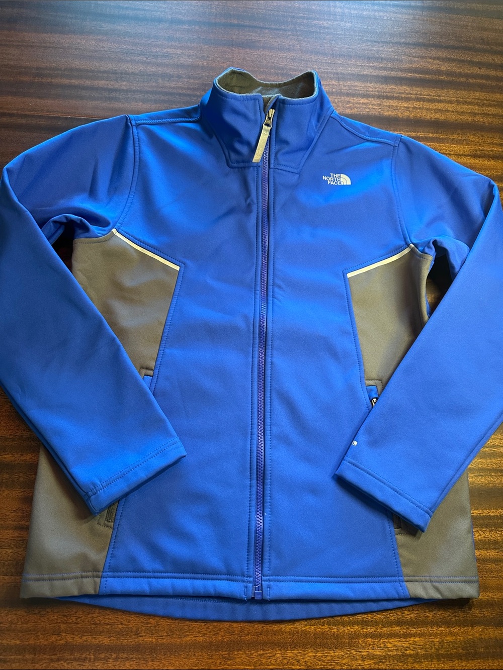 The North Face Kids Blue and Gray Softshell Puffer Jacket